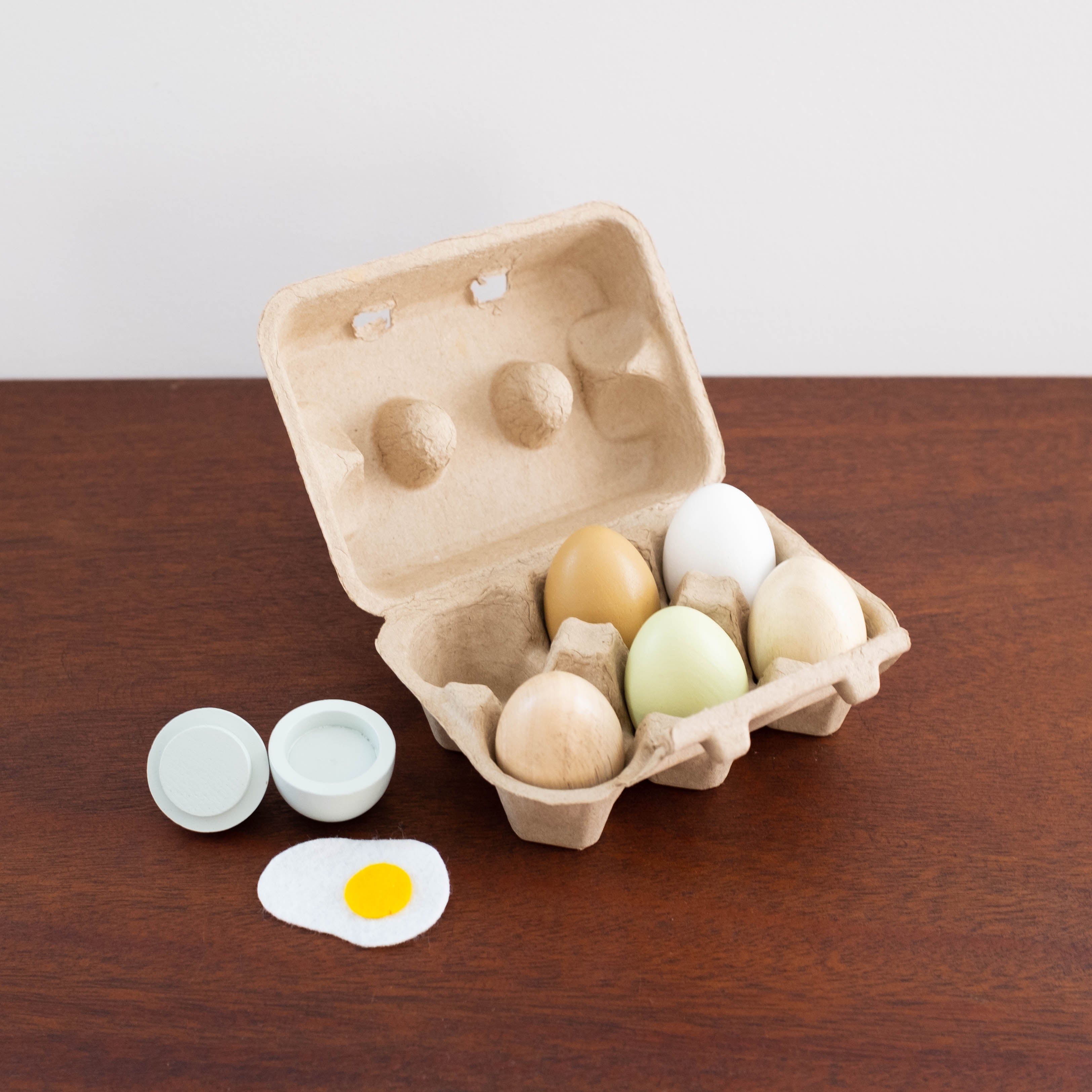 Wooden Eggs in a Carton