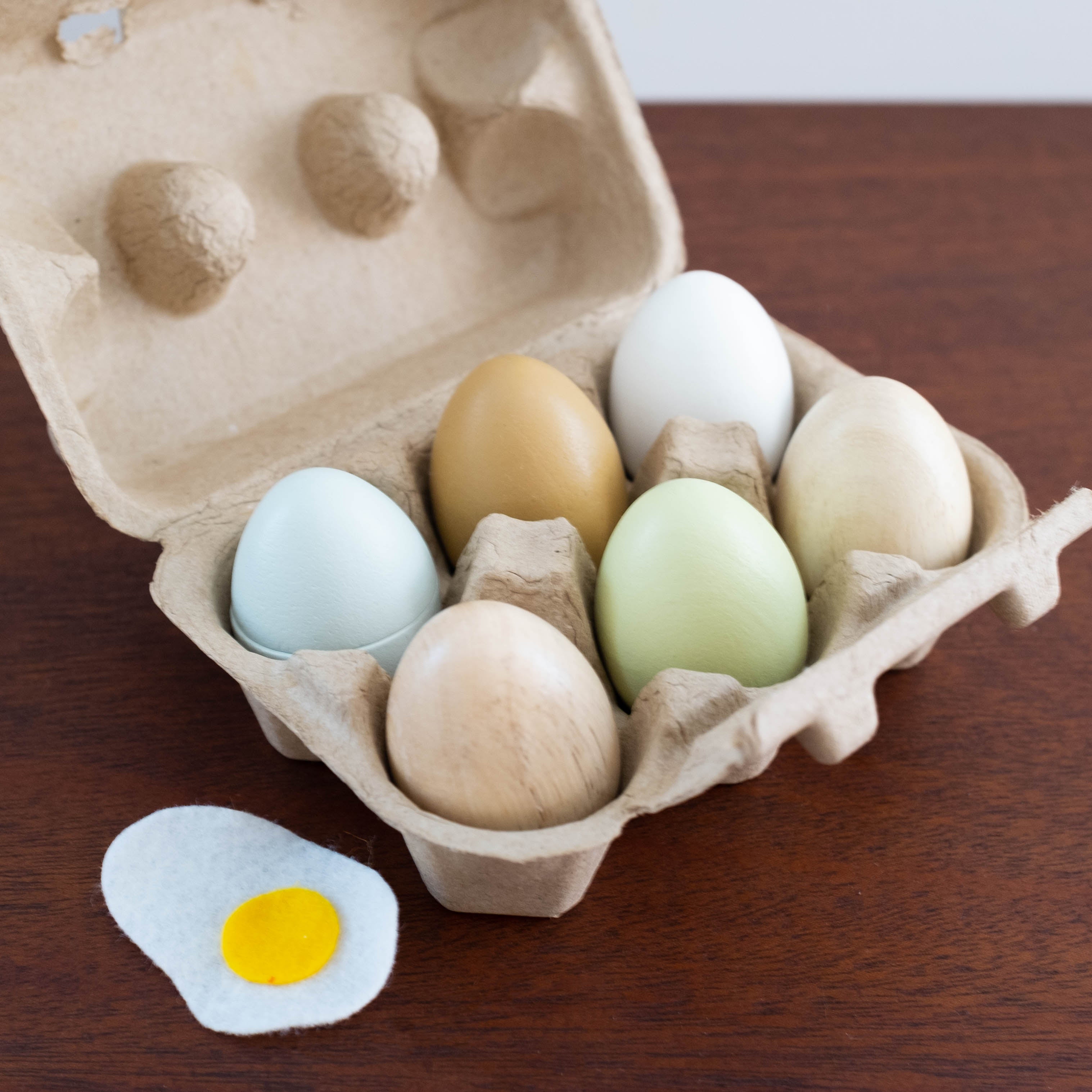 Wooden Eggs in a Carton